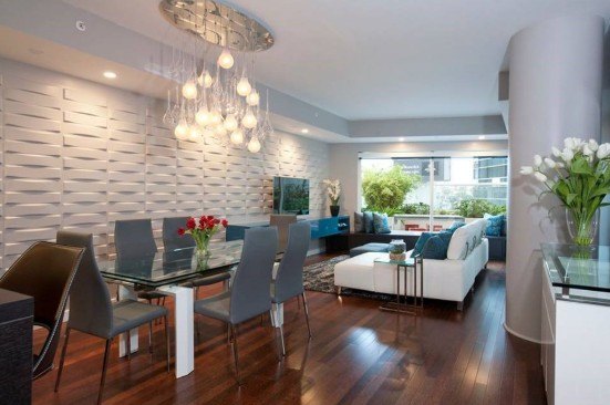 a dining room with a glass table and chairs